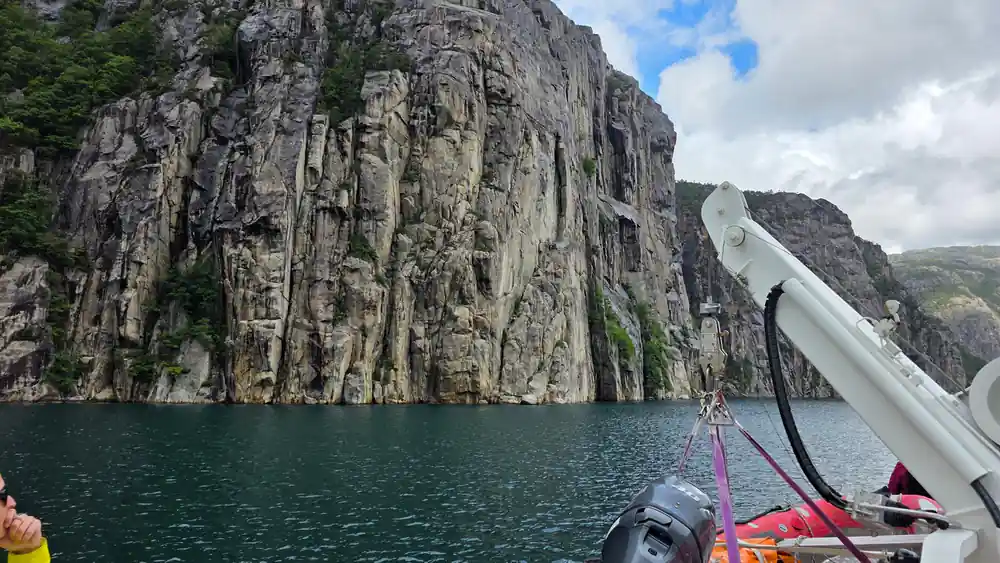 Basalt columnar formations viewed from boat on fjord