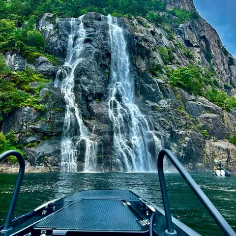 The Hengjanefossen waterfall dropping into the Lysefjord