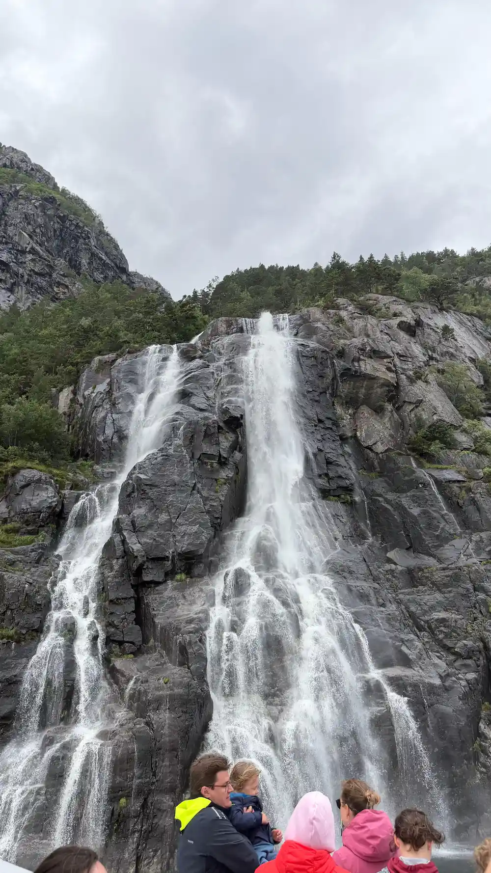 Waterfall cascading down rocky mountainside